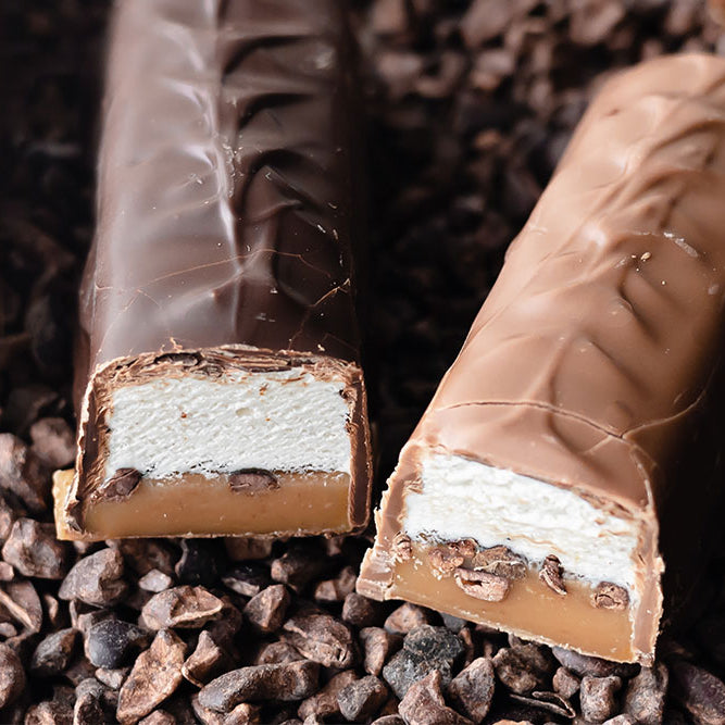 Image of Cocoa Nib Caramel Vanilla Nougat Candy Bars dipped in milk and dark chocolates 