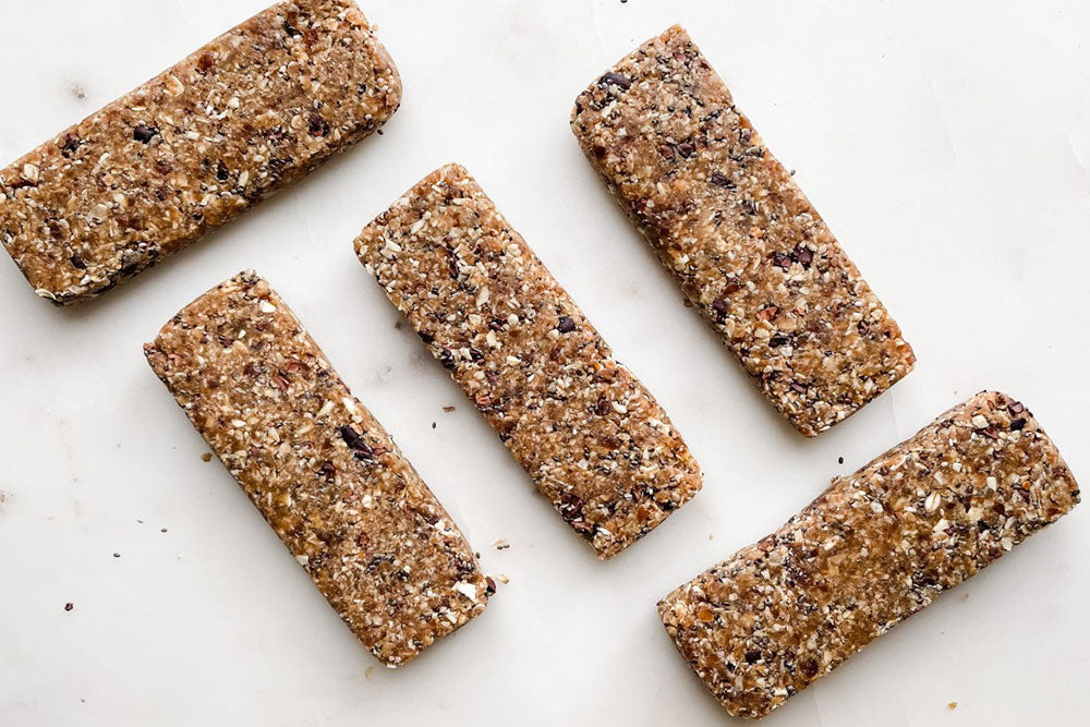 Homemade granola bars made with fruit and Luker Chocolate's Roasted Cocoa Nibs.