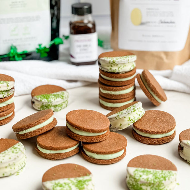 Image of Homemade Oreos dipped in white chocolate with Green Crystal Sugar