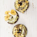 Chocolate cake donuts topped with banana flavored donut icing