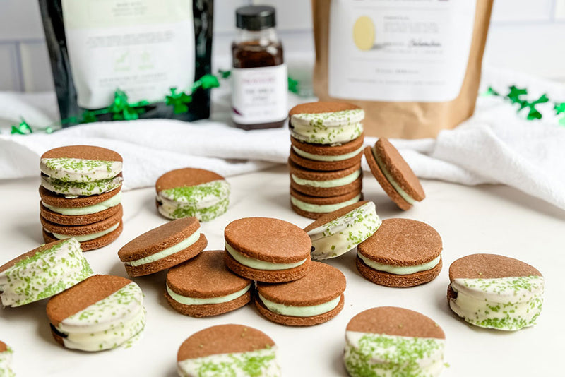 Image of Homemade Oreos dipped in white chocolate with Green Crystal Sugar