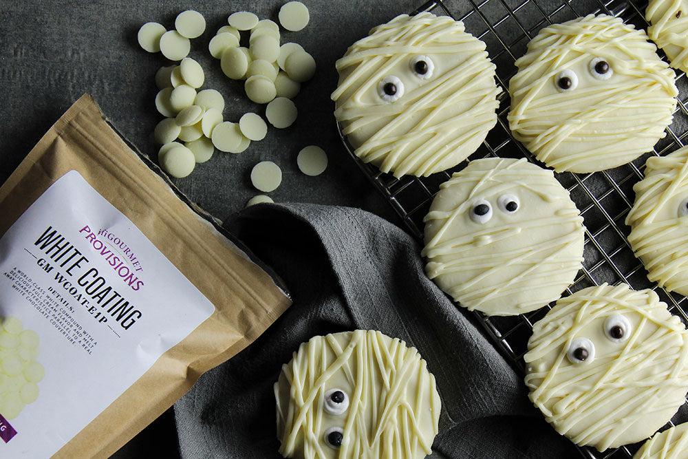 Sugar cookies coated in white chocolate to look like mummies