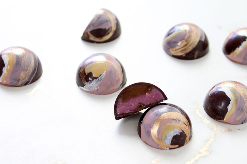 Colorful bonbons with a hibiscus honey caramel filling