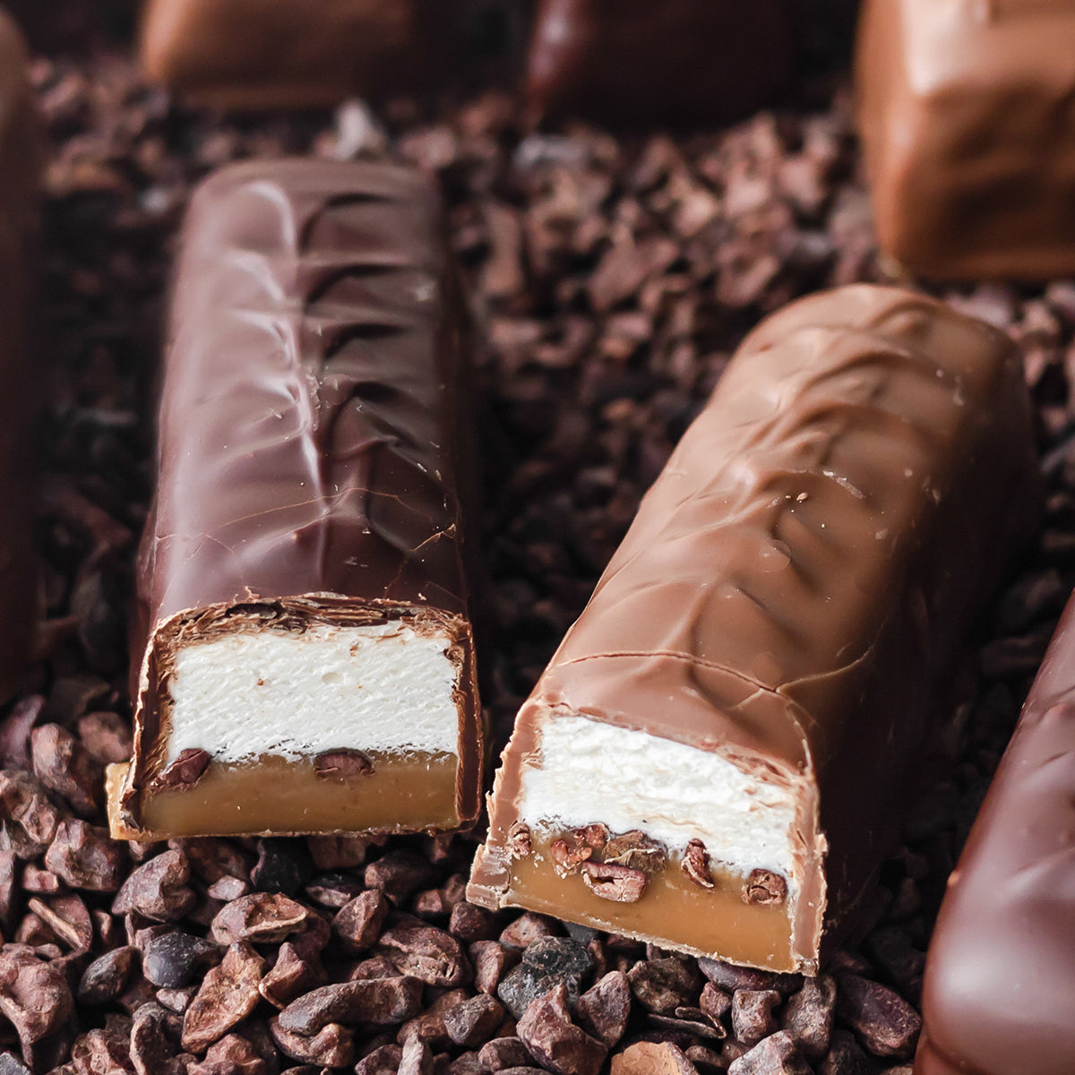 Chocolate bars with nougat, cocoa nibs, and caramel.