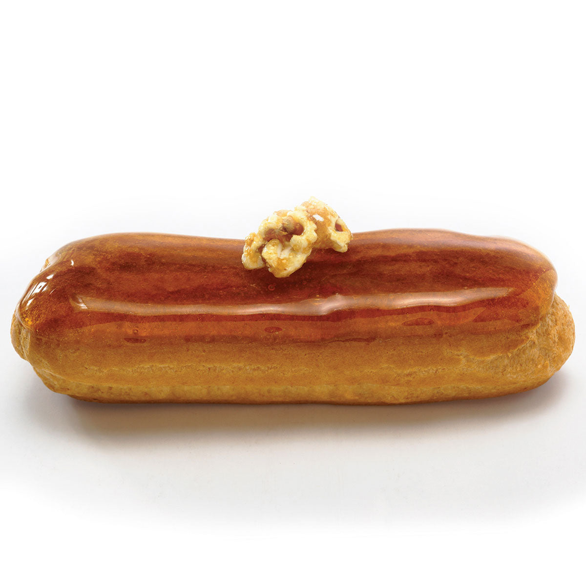 5" Eclair Shell dessert with caramel topping and decor
