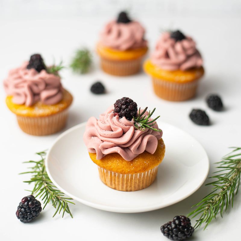 Vanilla Cupcake with Blackberry Flavored Buttercream topped with a blackberry