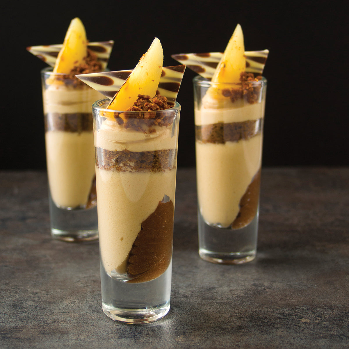 Layered parfait of caramel soaked sponge and pear flavored mousse