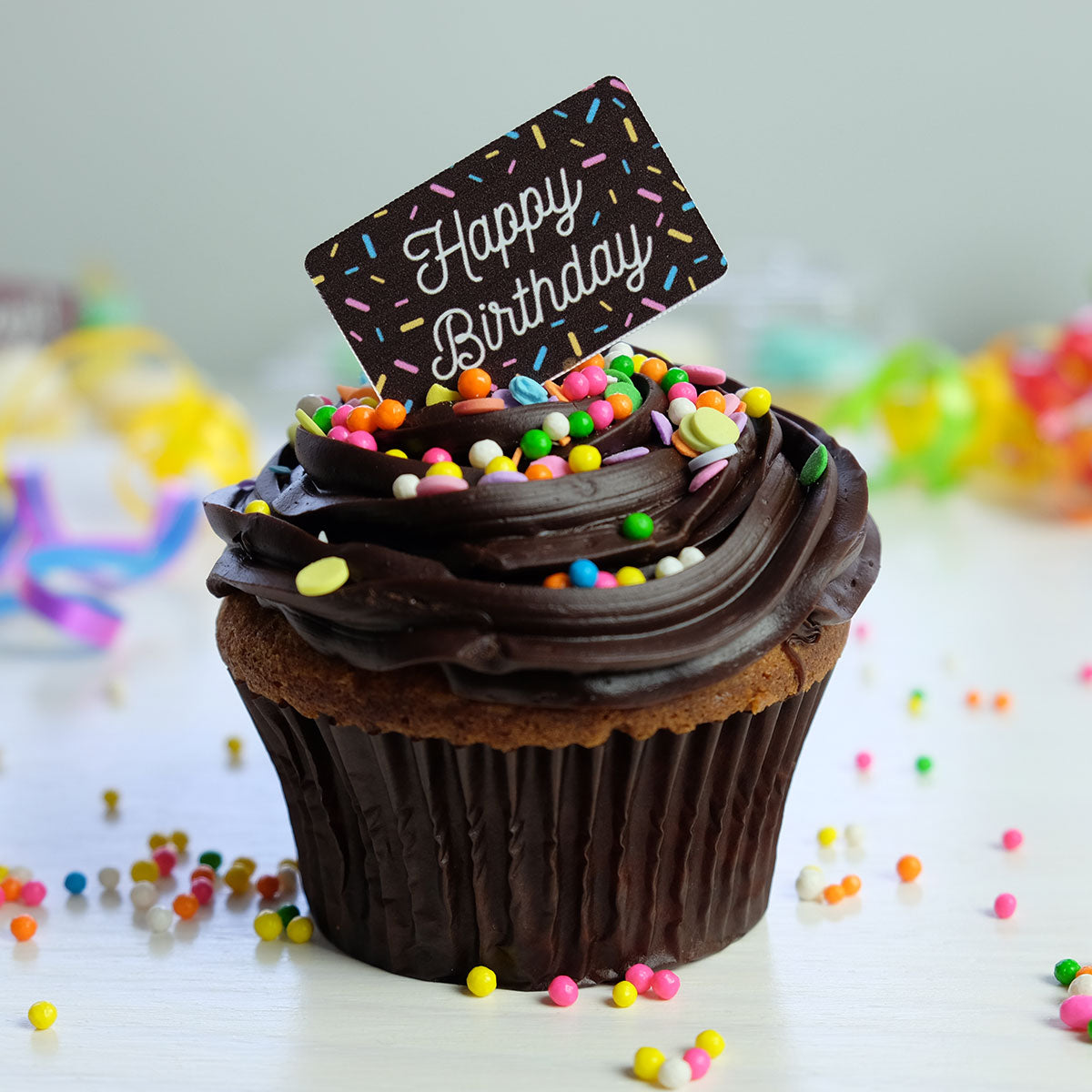 Sprinkles Birthday Chocolate Decor on chocolate cupcake