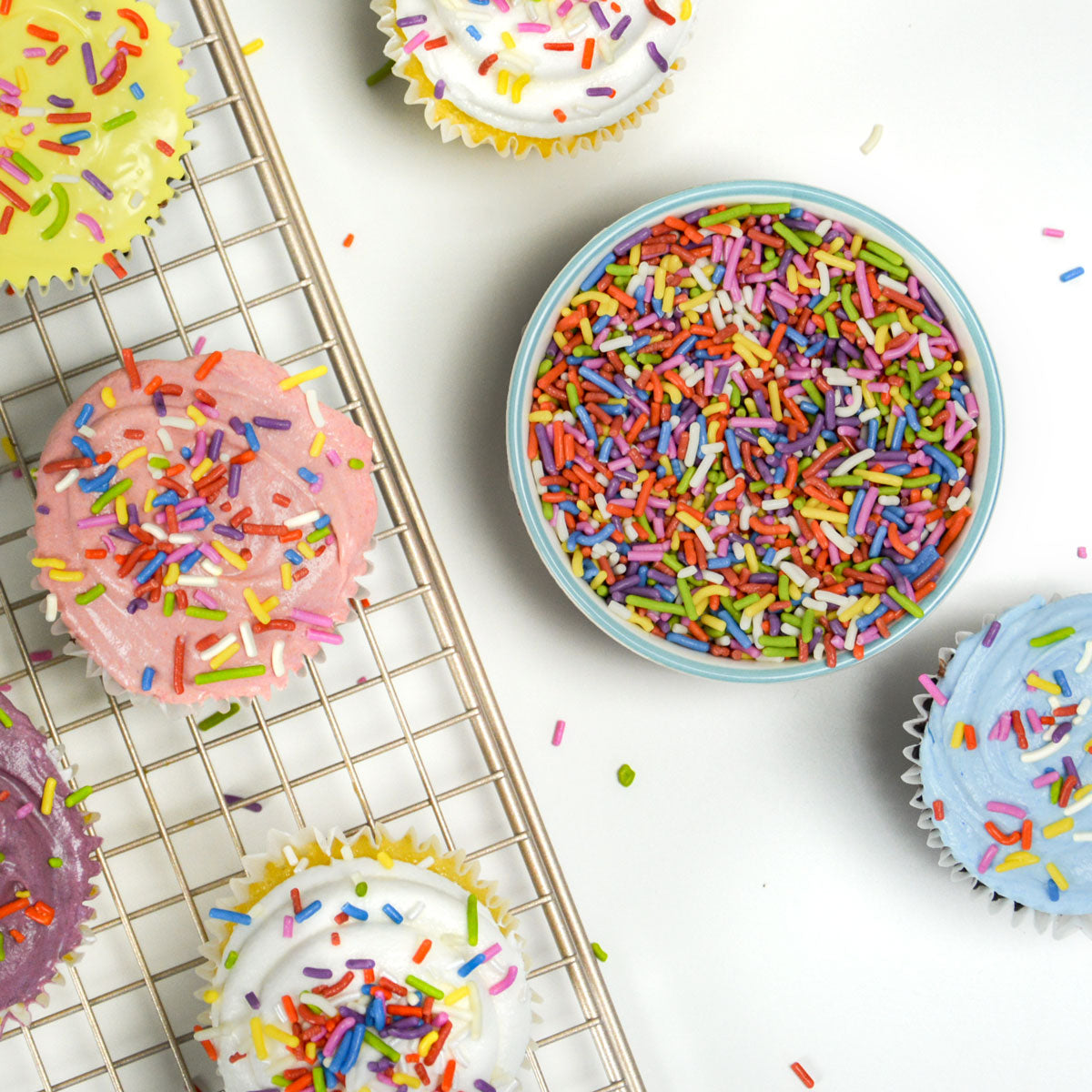 All natural rainbow sprinkles on cupcakes